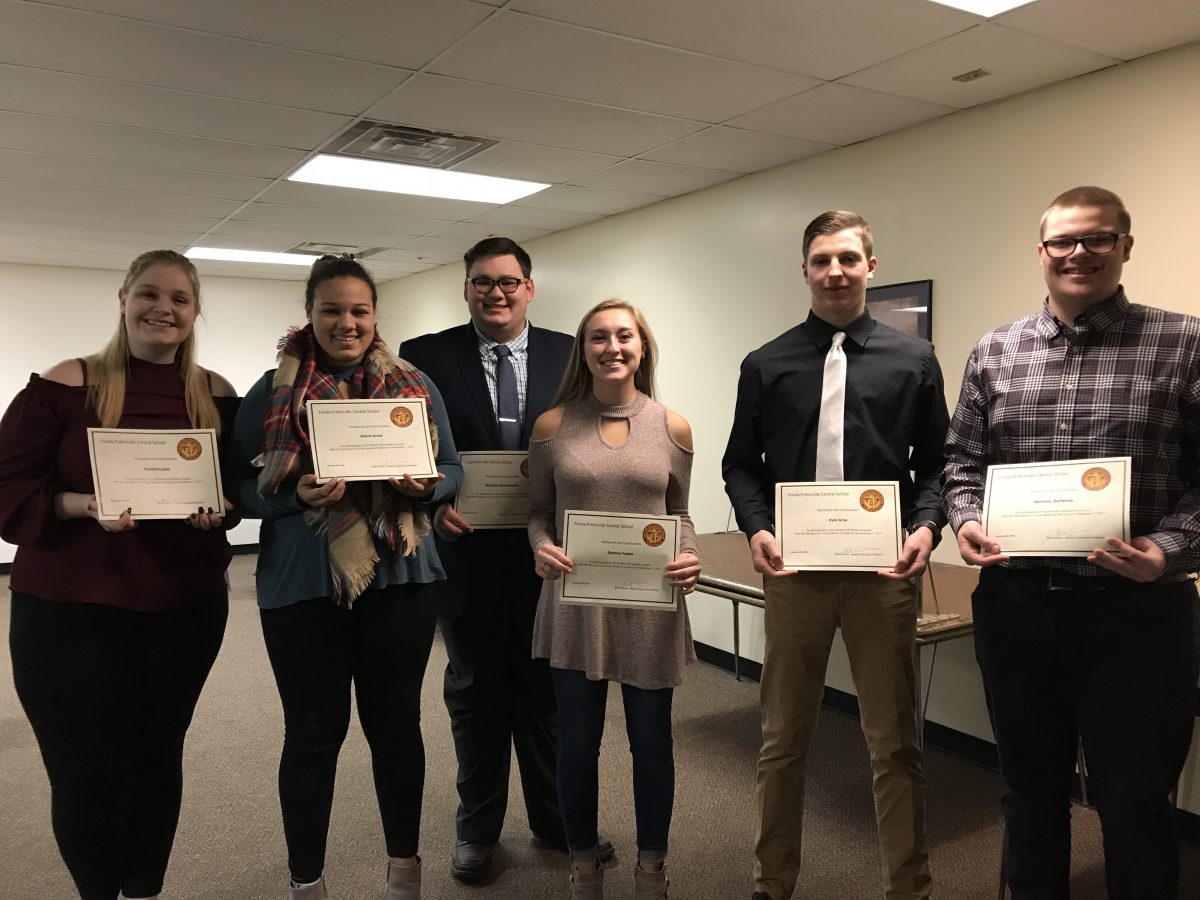 six high school students hold up certificates