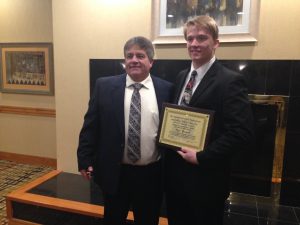 high school football coach with scholar athlete