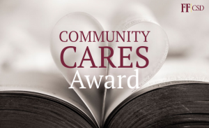 Community Cares Award with book pages folded into a heart