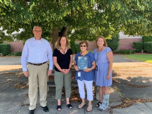 FFCSD Director of Transportation Mrs. Hayes presented with New York State Education Department Safety Drill Award. From left to right - New York Association for Pupil Transportation Executive Director Dave Christopher; Public Transportation Safety Institute Training Development Specialist Debra Sisson, FFCSD Direcotr of Transportation Donna Hayes and FFCSD sixth grade teacher and transportation substitute Laura Hayes-Bowles. 