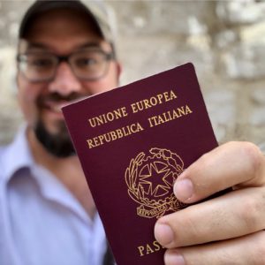 Mr. Farina proudly displaying his Italian passport.