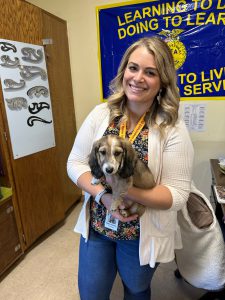 Ms. Holmes posing with a friend during the 2022-23 school year.