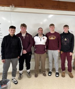 From left to right: F-F Football Team Captain Jose Vargas, F-F Football Team Captain Aidan Frederick, Coach Mancini, F-F Football Team Captain Logan Miller, and F-F Football Team Captain Brady Melious.