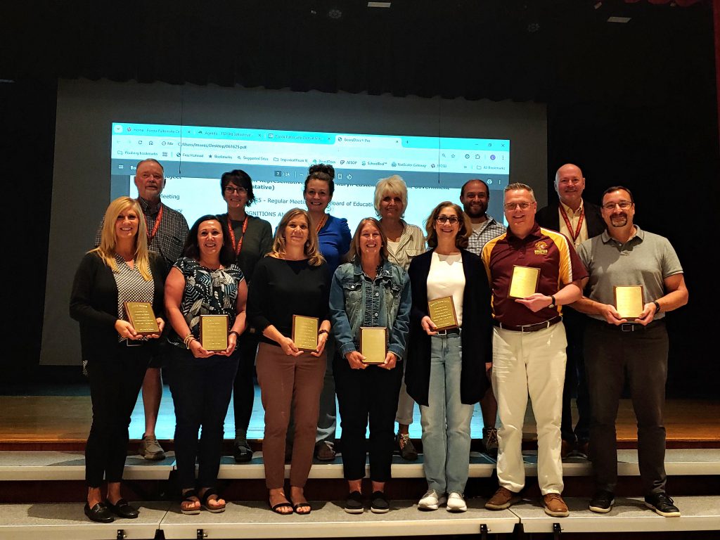 Board of Education members (back row, left to right) Dennis Egleston, Michelle Isabella, Matt Sullivan, Adam Sullivan, Jessica Munson and Bonnie Couture.